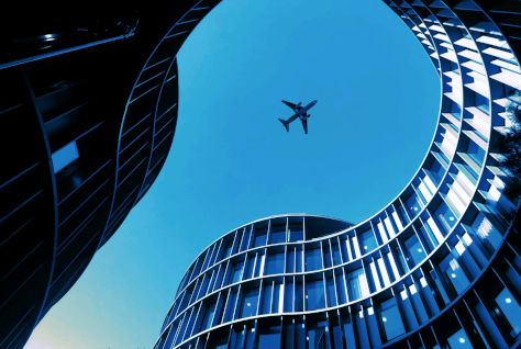 buildings with plane overhead